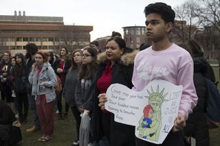 Approximately 100 students gather on the Quad for the Women’s Day Sanctuary Campus Rally.