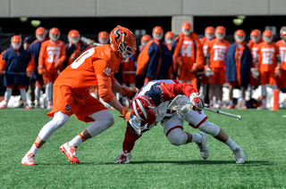 The Orange's Peter Dearth tries to take the ball from a tripped up SJU player. 